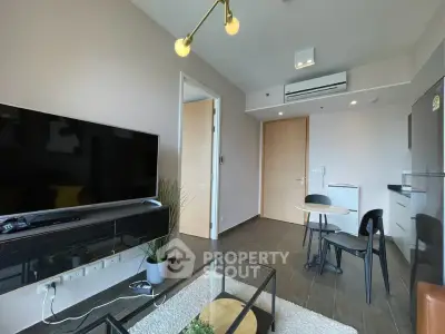 Modern living room with sleek furniture and stylish decor in a contemporary apartment.