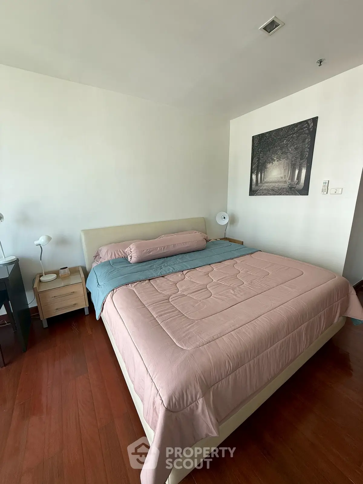 Cozy bedroom with elegant decor and wooden flooring