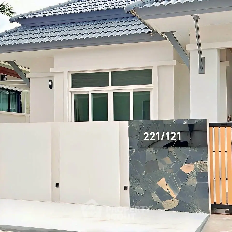 Modern house exterior with stylish facade and sleek roof design