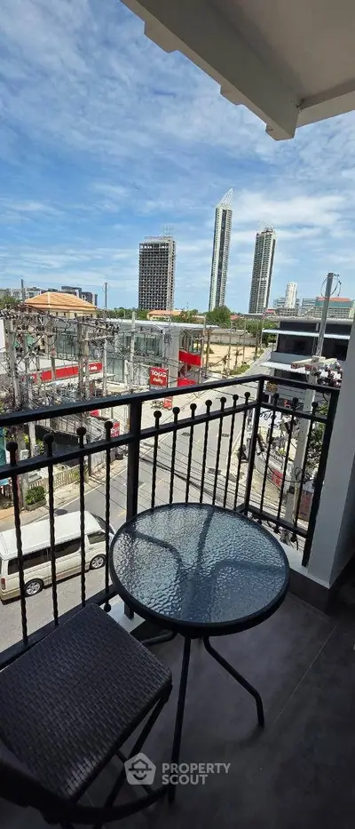 Charming balcony with city view, perfect for relaxation and enjoying urban scenery.