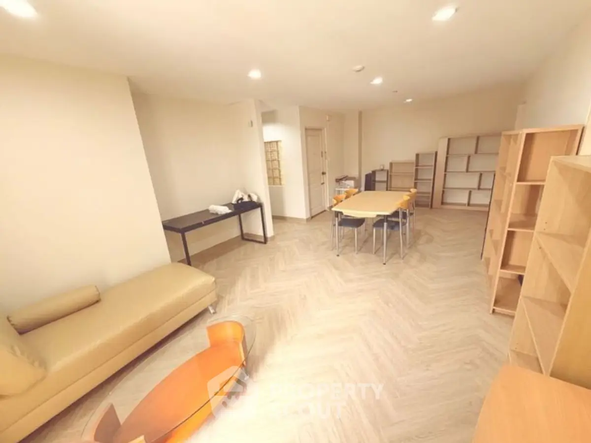 Spacious living room with modern furniture and ample natural light