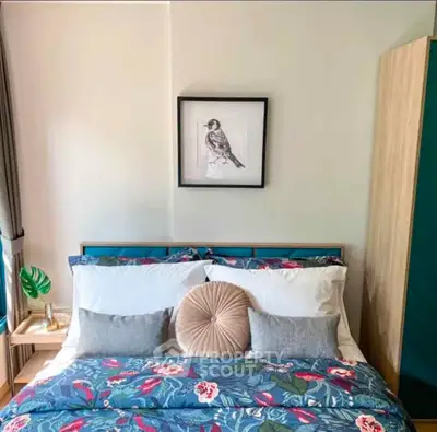 Charming bedroom with stylish decor and vibrant bedding, perfect for a cozy retreat.