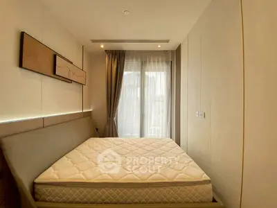 Modern bedroom with large window and stylish decor in a contemporary apartment.