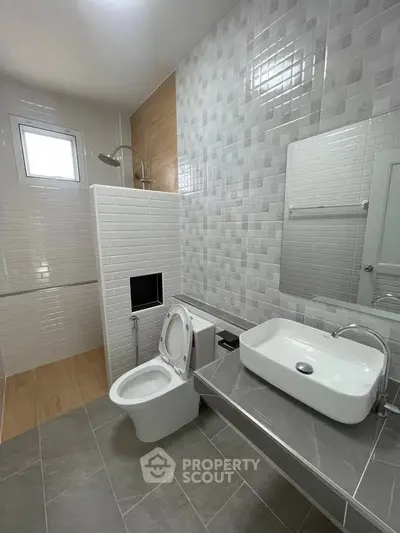 Modern bathroom with sleek tiles and contemporary fixtures