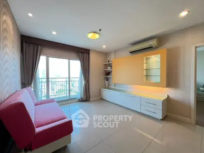 Spacious living room with city view and modern furnishings