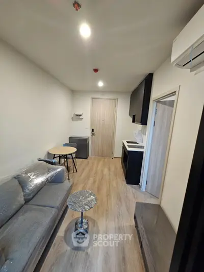 Modern compact living room with sleek furniture and open layout, perfect for urban living.