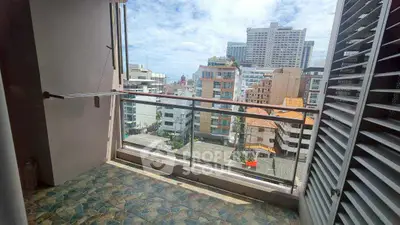 Spacious balcony with city view in modern apartment building