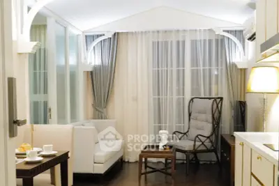 Elegant living room with stylish furniture and soft lighting, featuring a cozy seating area and decorative accents.