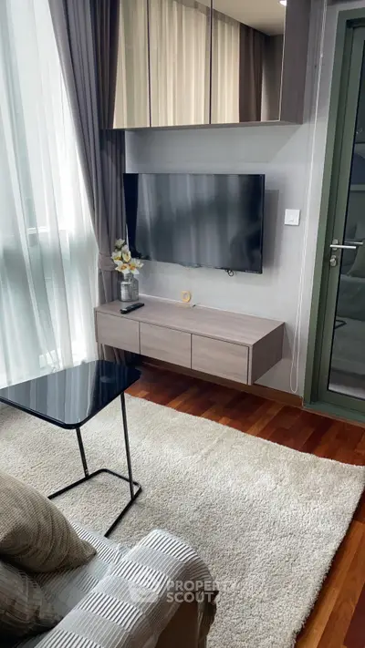 Modern living room with sleek TV setup and elegant decor