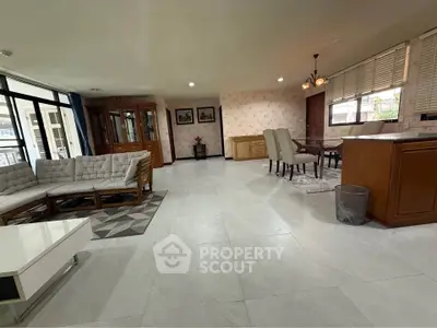 Spacious open-plan living and dining area with modern furnishings