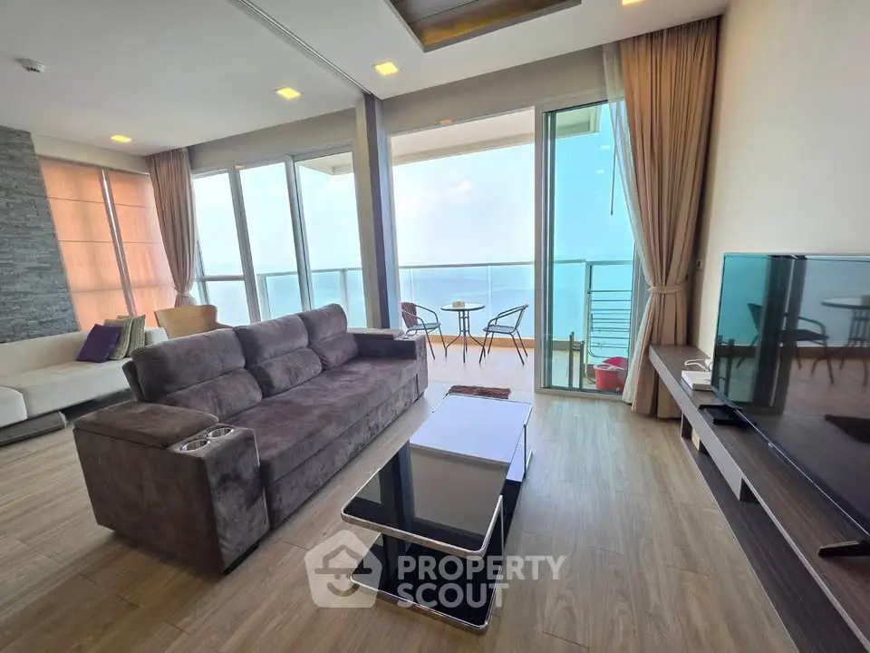 Spacious living room with ocean view and modern furnishings