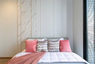 Modern bedroom with stylish decor and natural light