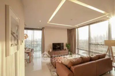 Luxurious living room with modern decor and stunning city view, featuring a spacious layout and elegant furnishings.