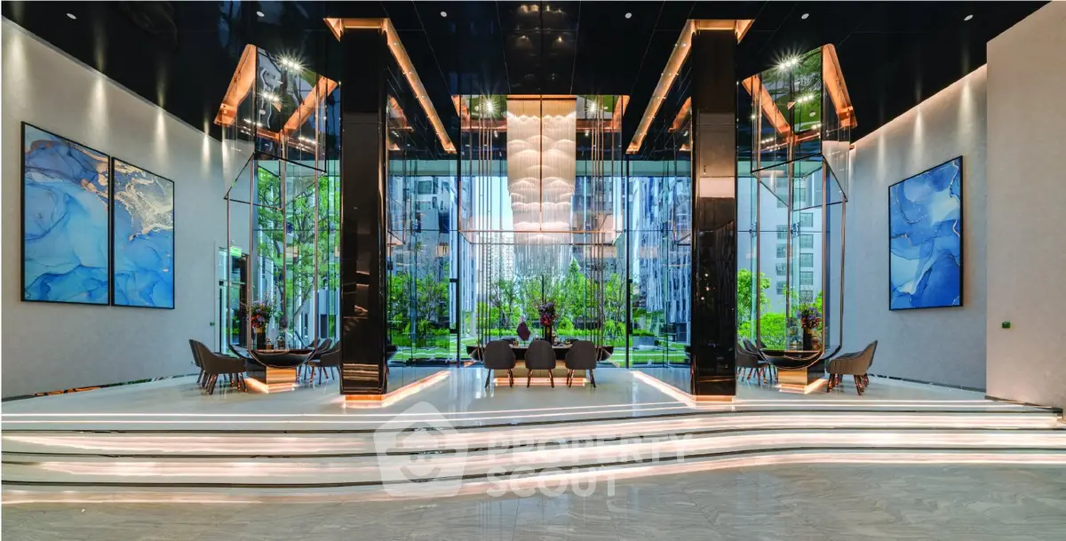 Luxurious building entrance with modern design and stunning garden view.