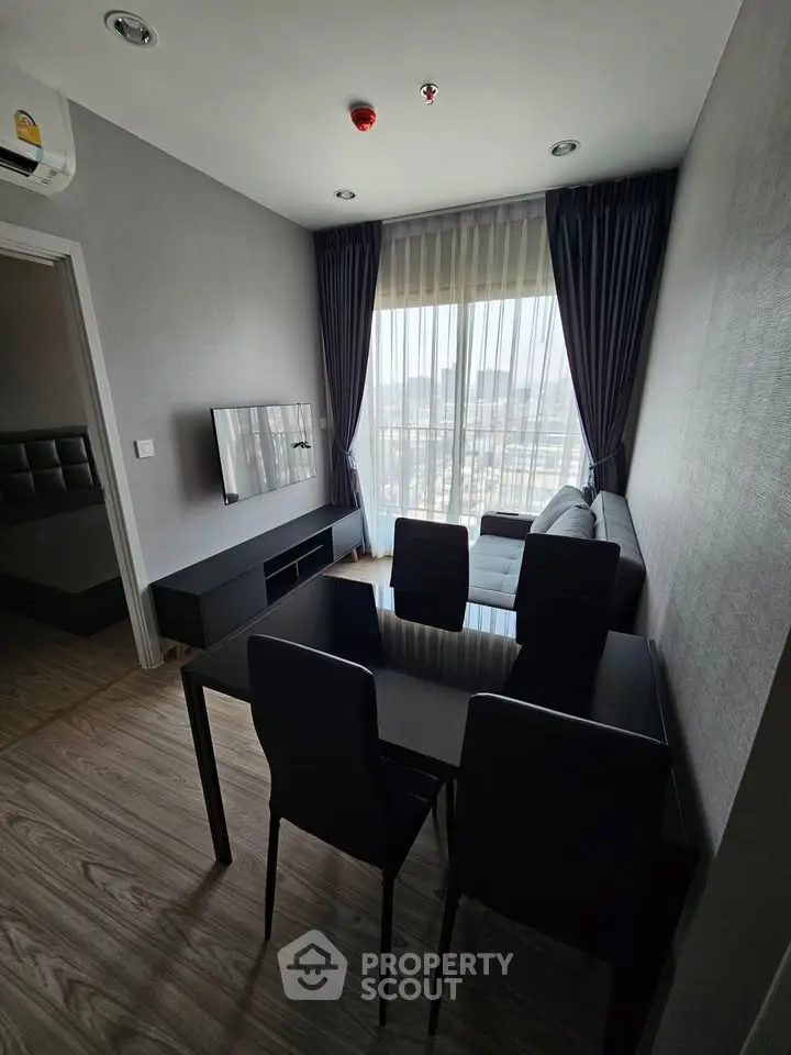 Modern living room with sleek furniture and city view, perfect for urban living.
