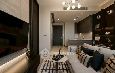 Modern living room with stylish decor and open kitchen layout in luxury apartment.