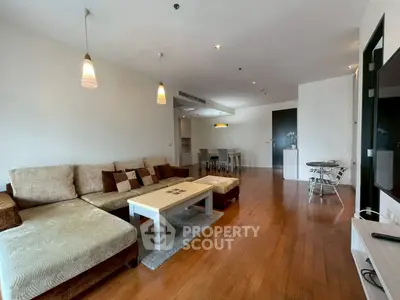 Spacious modern living room with elegant decor and wooden flooring