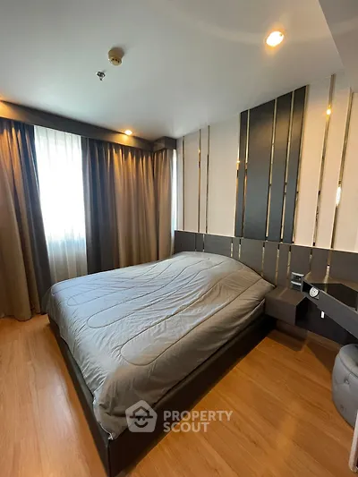 Modern bedroom with stylish decor and natural light
