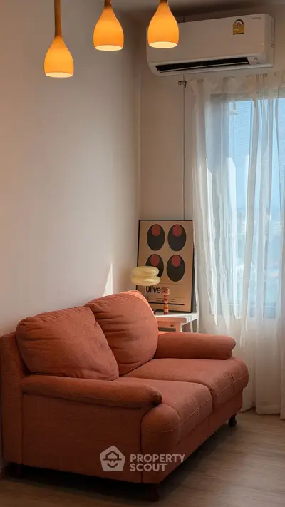 Cozy living room with stylish sofa and modern decor, perfect for relaxation.