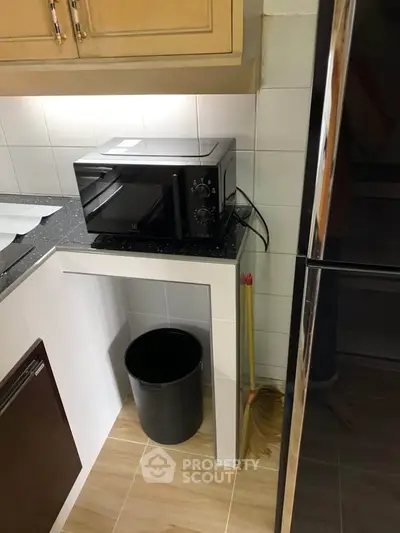 Compact kitchen corner with modern appliances and sleek design