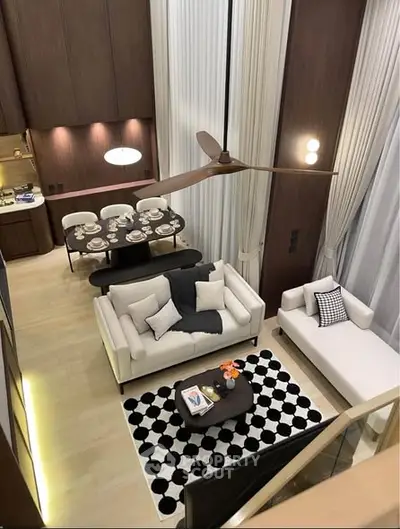 Luxurious modern living room with high ceilings and elegant decor