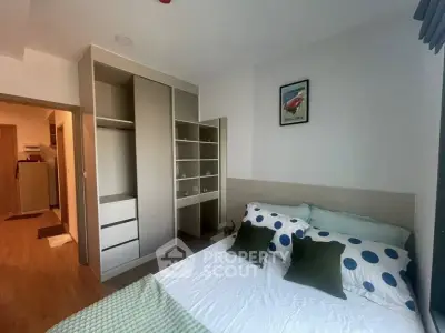 Modern bedroom with stylish decor and ample storage space