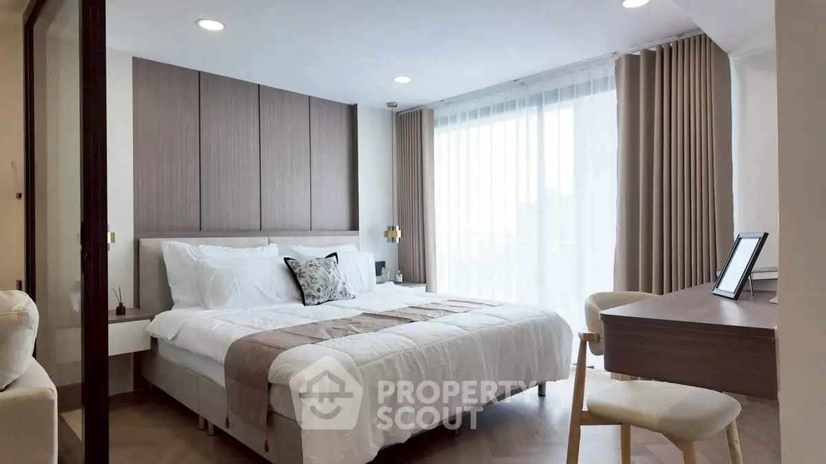 Modern bedroom with elegant decor and natural light