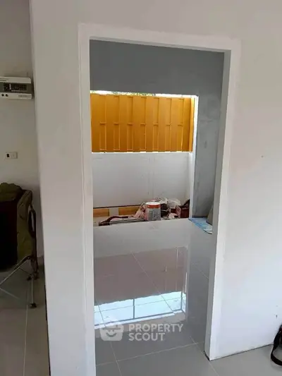 Modern interior with glossy tiled floor and bright window view