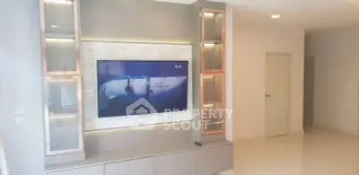 Modern living room with sleek TV unit and ambient lighting