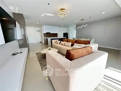 Spacious modern living room with open kitchen and stylish decor