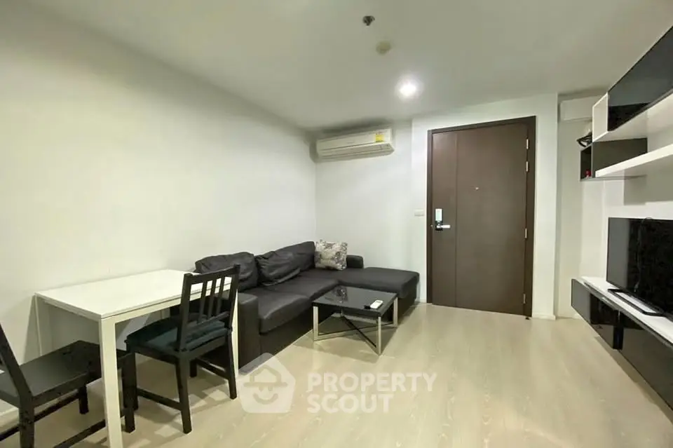 Modern living room with sleek furniture and minimalist design in a cozy apartment.
