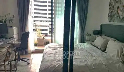 Cozy bedroom with balcony access and modern decor