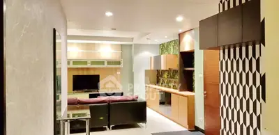 Modern living room with stylish decor and entertainment center
