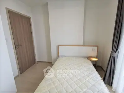 Cozy and inviting bedroom with ample natural light, featuring a large comfortable bed, elegant nightstand, and tasteful curtains, perfect for restful nights.