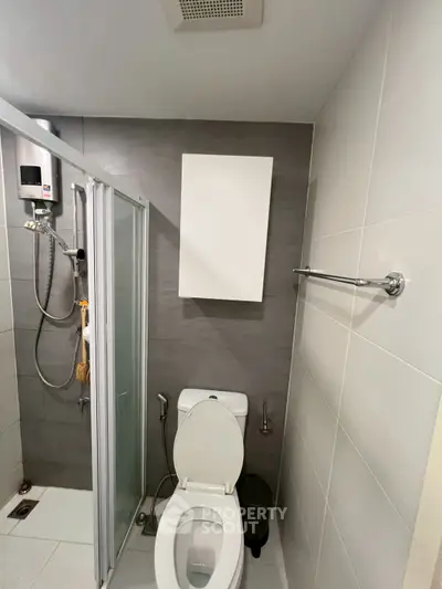 Modern bathroom with shower and toilet in compact space