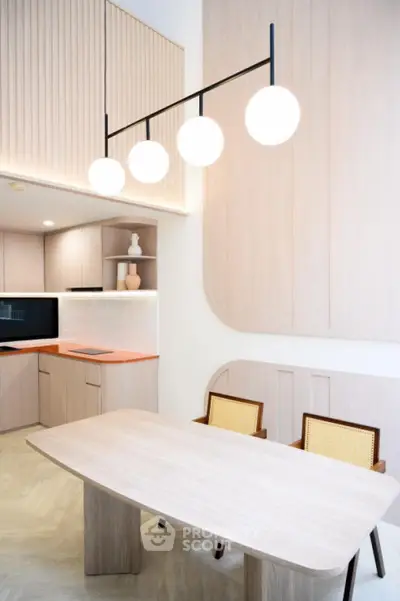 Modern kitchen with sleek design, open layout, and stylish lighting