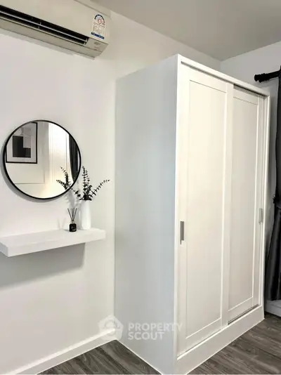 Modern bedroom with sleek wardrobe and stylish decor