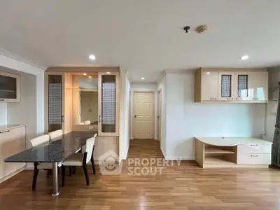 Spacious modern living room with elegant dining area and wooden flooring