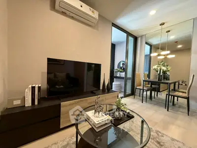 Modern living room with stylish decor and open dining area