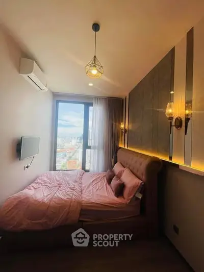 Cozy bedroom with city view, modern lighting, and stylish decor.