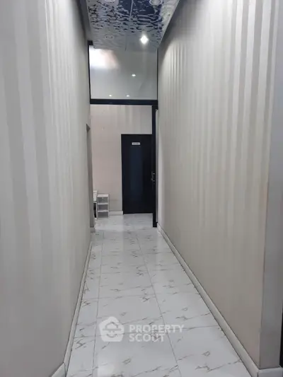 Elegant hallway with modern design and glossy tiled flooring