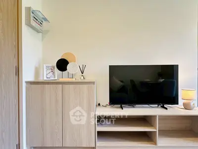 Modern living room with stylish TV setup and wooden furniture