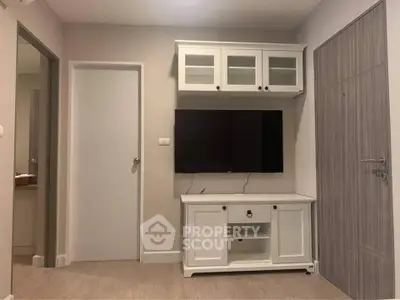 Modern living room with sleek TV unit and stylish cabinetry