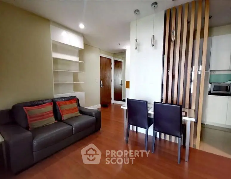 Modern living room with sleek furniture and open layout in a stylish apartment.
