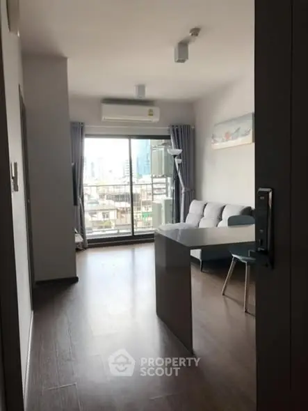 Modern living room with balcony view in urban apartment