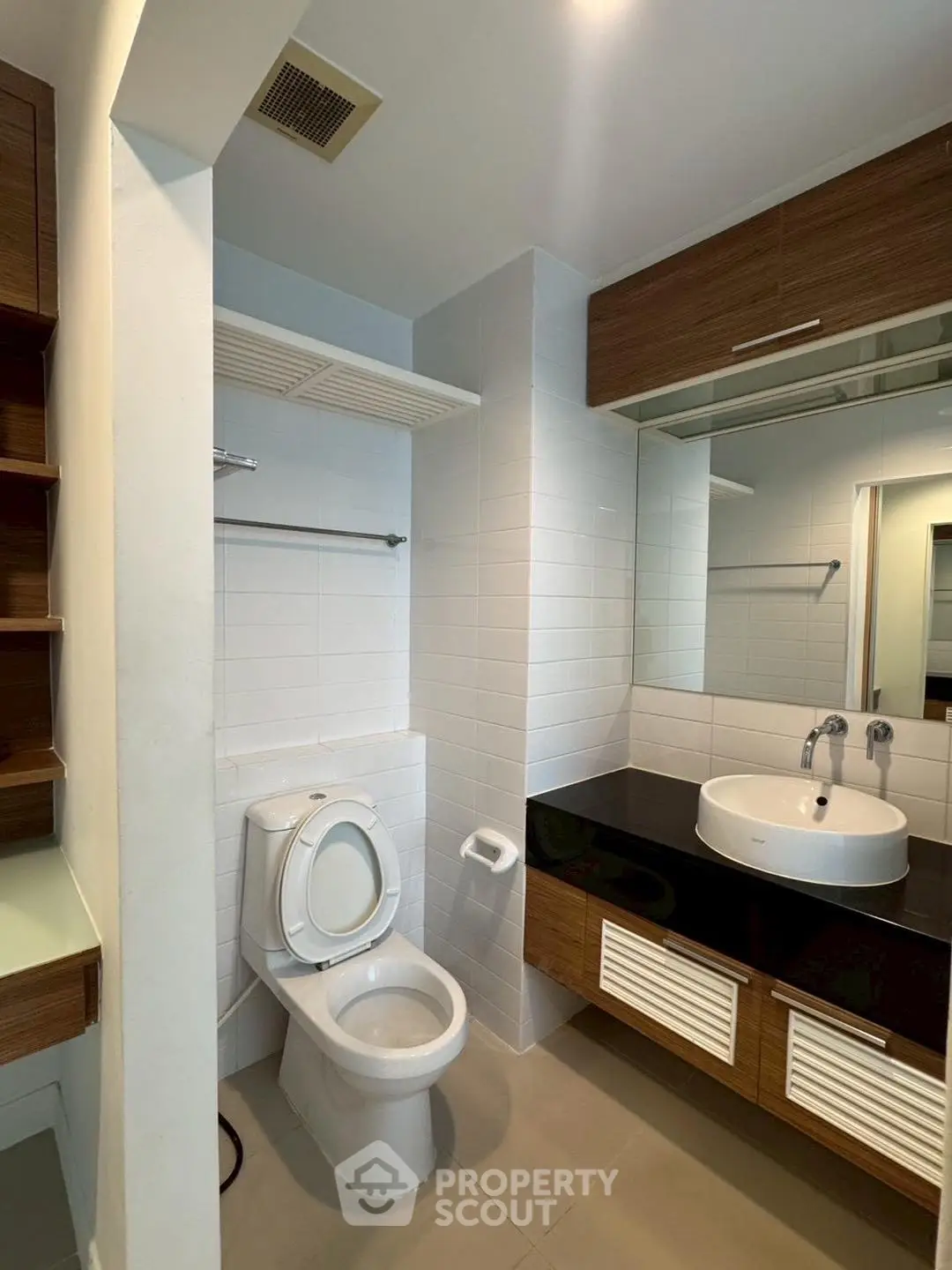 Modern bathroom with sleek fixtures and ample storage space