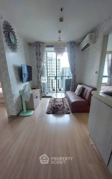 Modern living room with balcony view in high-rise apartment