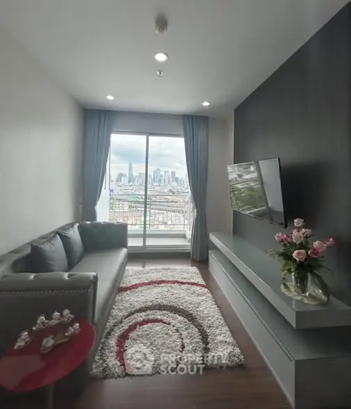 Modern living room with city view, stylish decor, and cozy seating area.