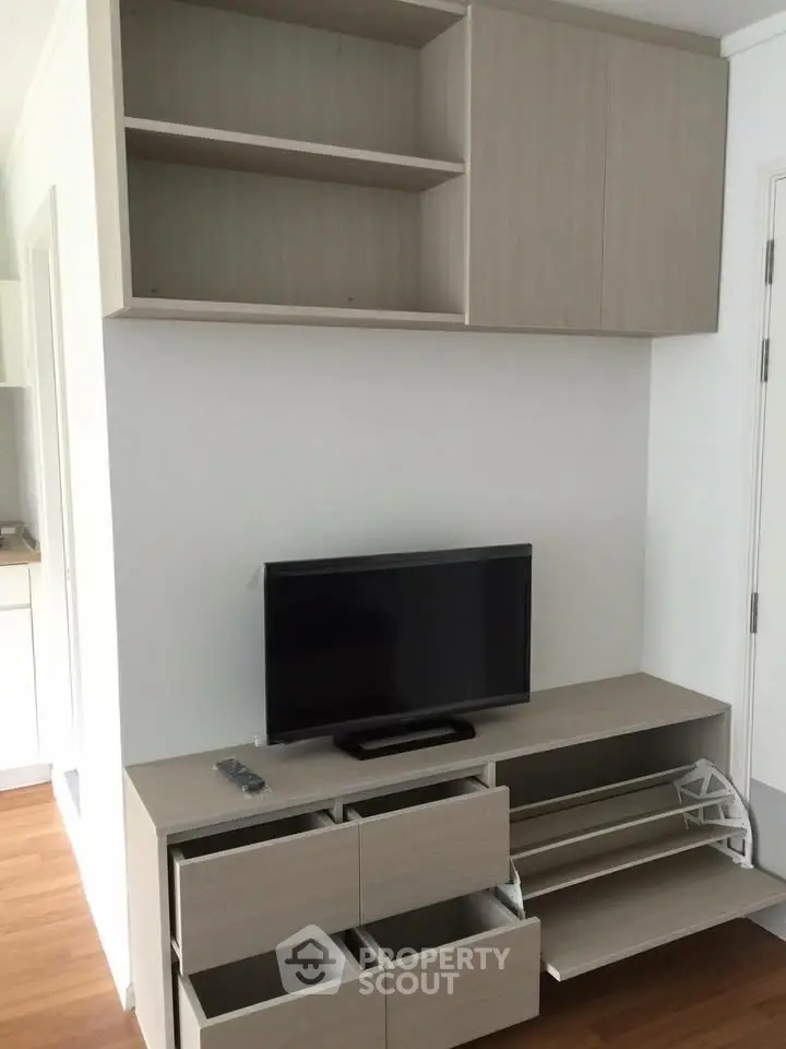 Modern living room with sleek TV stand and ample storage space