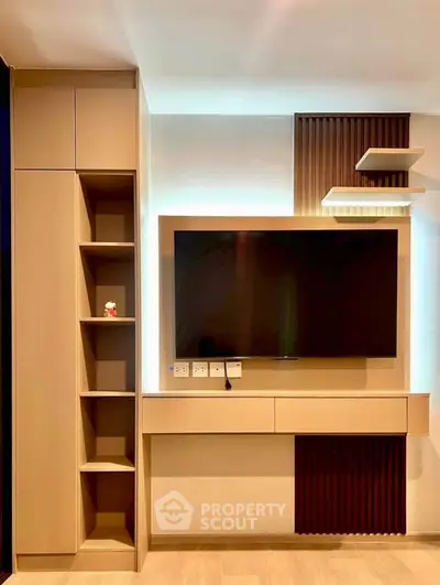Modern living room with sleek TV unit and stylish shelving, perfect for contemporary homes.
